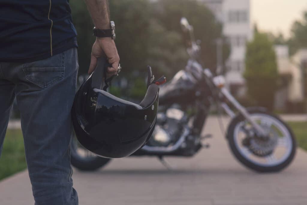 North Carolina motorcycle rider with helmet and bike.